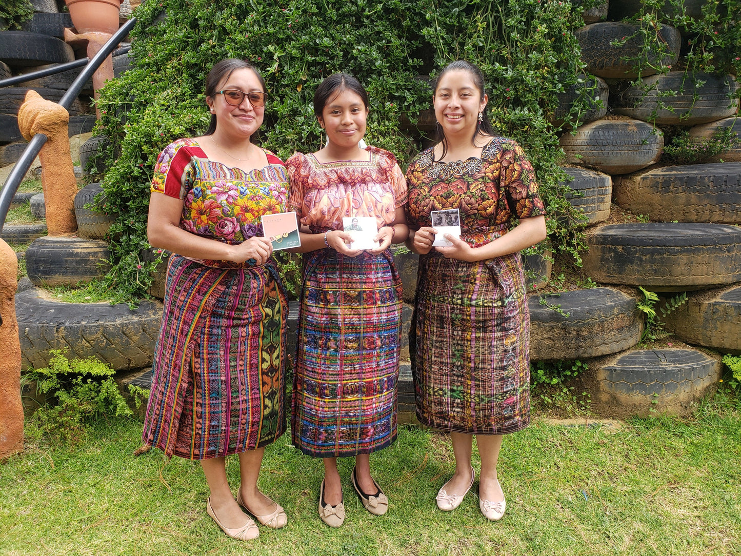 Melissa who was our muse for the Guatemala studs. She recieved her very own pair. and shared the moment in a photo with her teachers. she is very proud